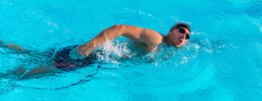 Man swimming for health benefits