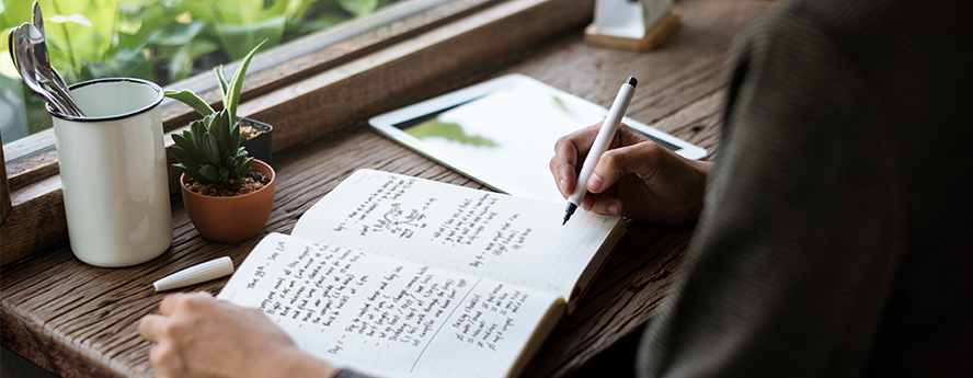 Woman writing in her journal