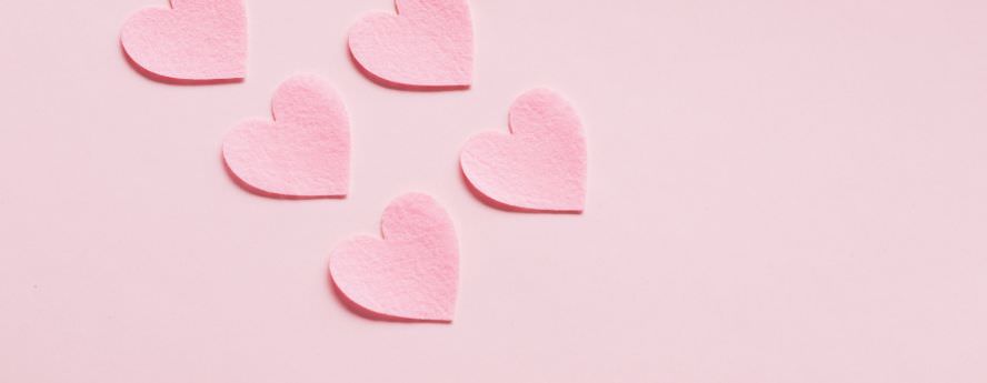 Pink Cut Out Heart Shapes On Pink Background 
