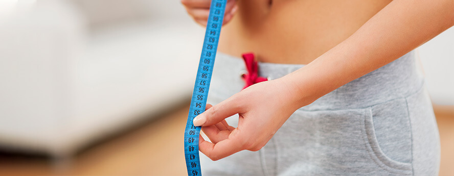 Healthy Women Measuring Waist With Tape
